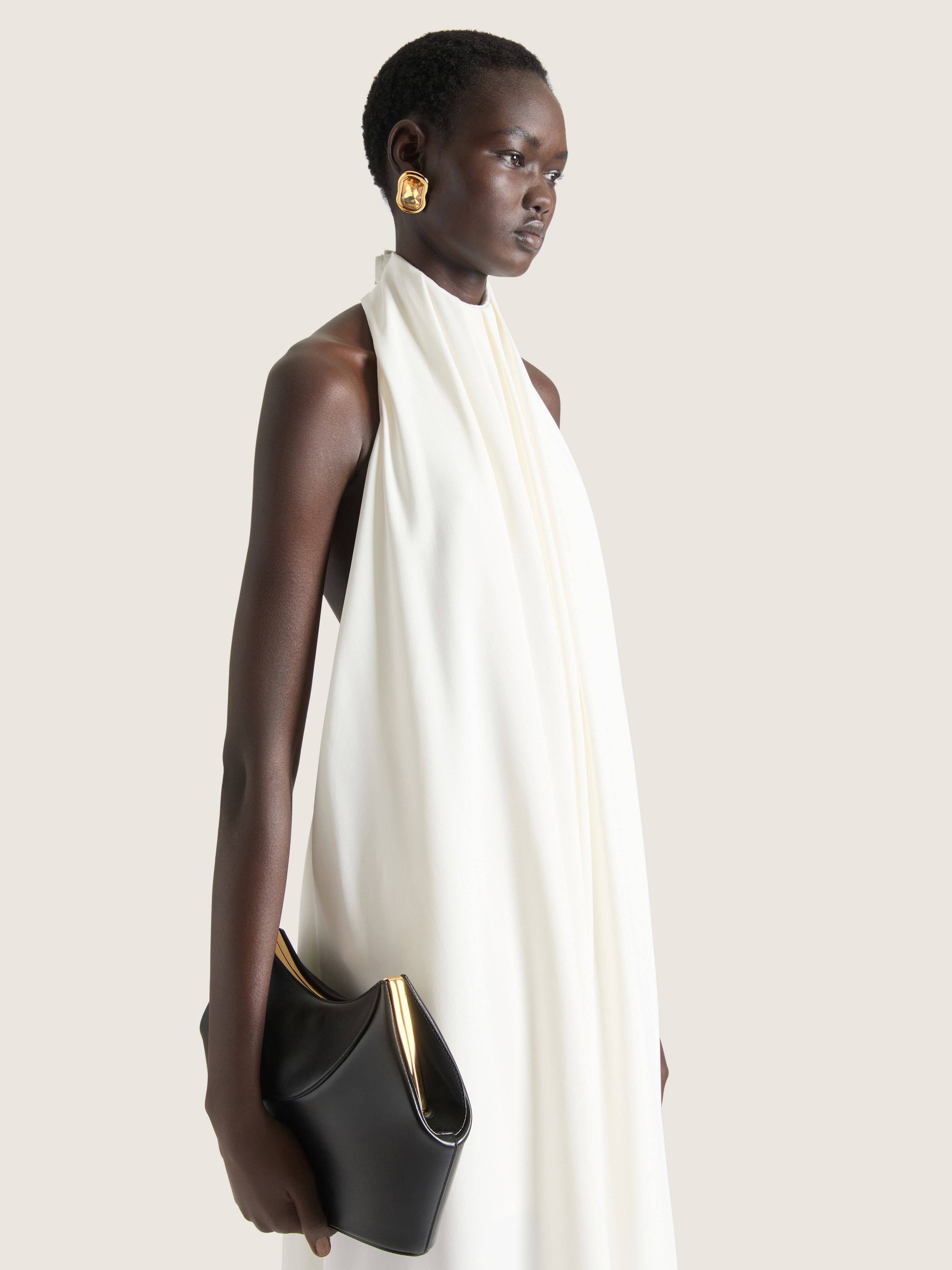 Facet clutch in leather